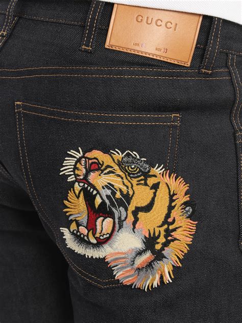 jeans gucci uomo tigre anni 90|Gucci Jeans & Denim for Men .